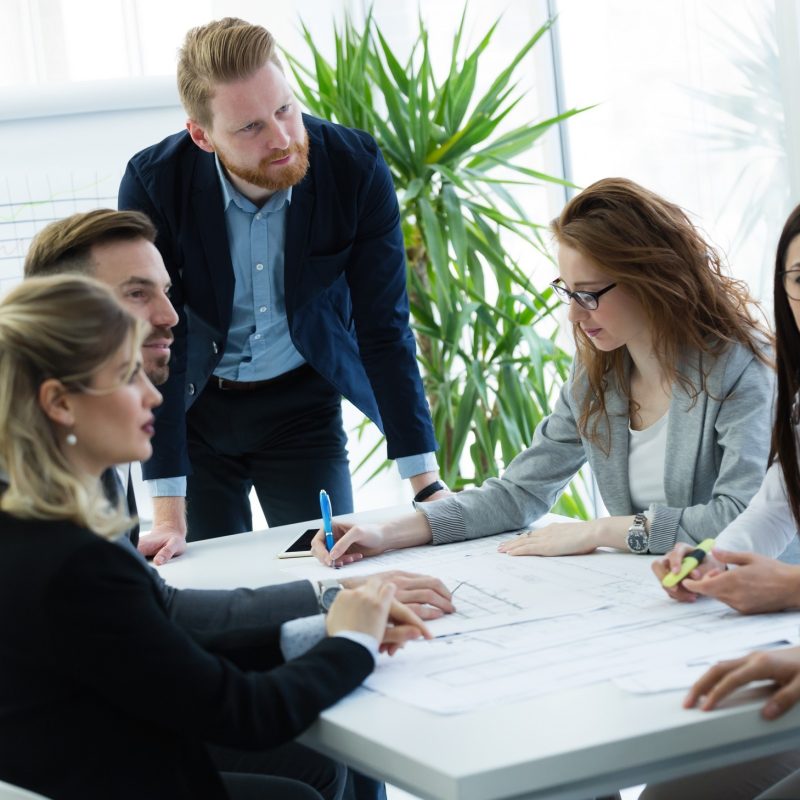 Group of business people collaborating on project  in office